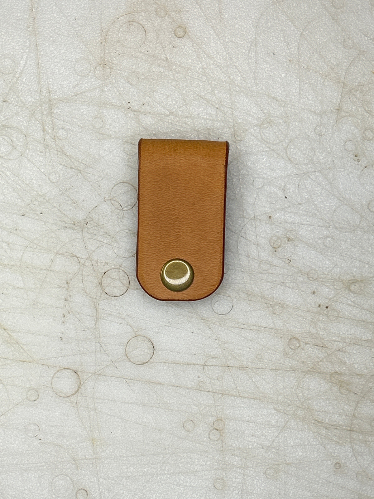Natural leather cord keeper