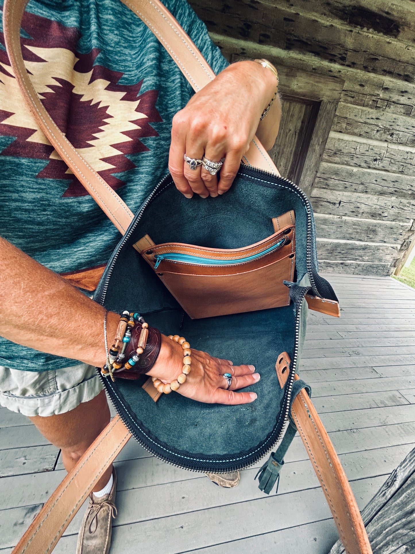 Zippered leather tote with tooling and interior pockets